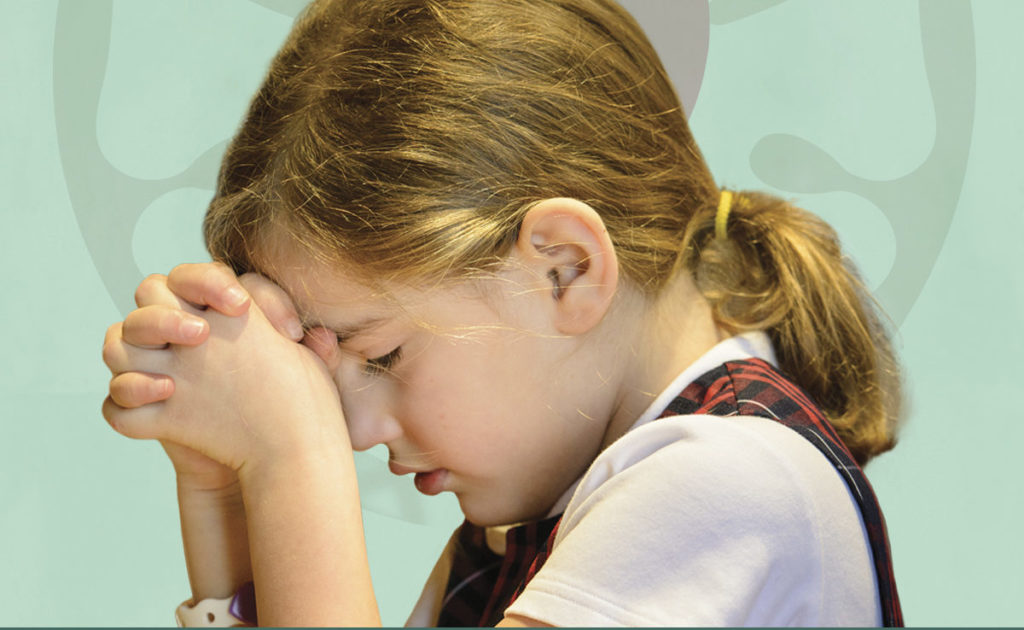 chapel service. girl praying.