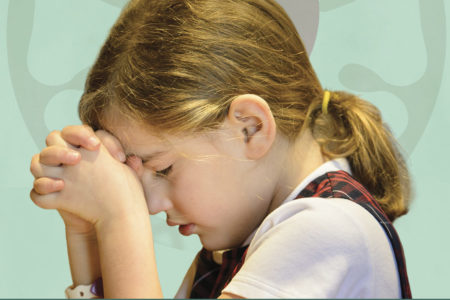 chapel service. girl praying.