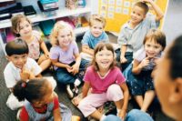 Children seated on the floor with their teachers during Sunday School at Immanuel Lutheran Church, Joplin, Missouri