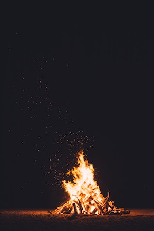 small fire with sparks swirling upward