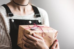 girl holding package advent wait a long time coming immanuel lutheran church joplin missouri