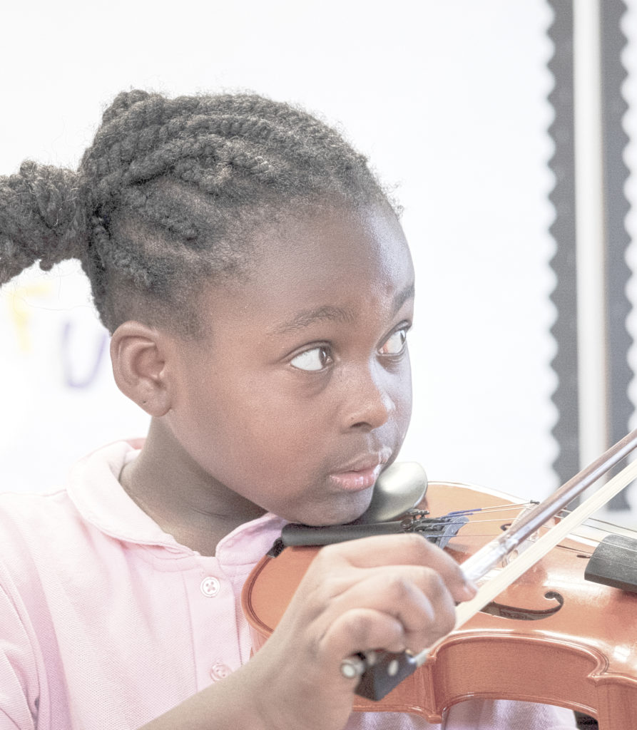 national lutheran schools week. girl playing violin. music class. 2020.