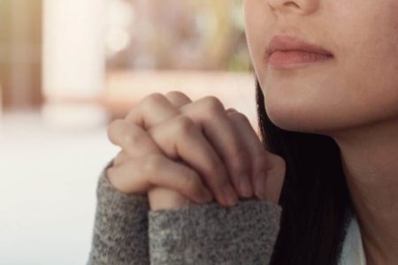 woman praying. LWML Lutheran Women in Mission.