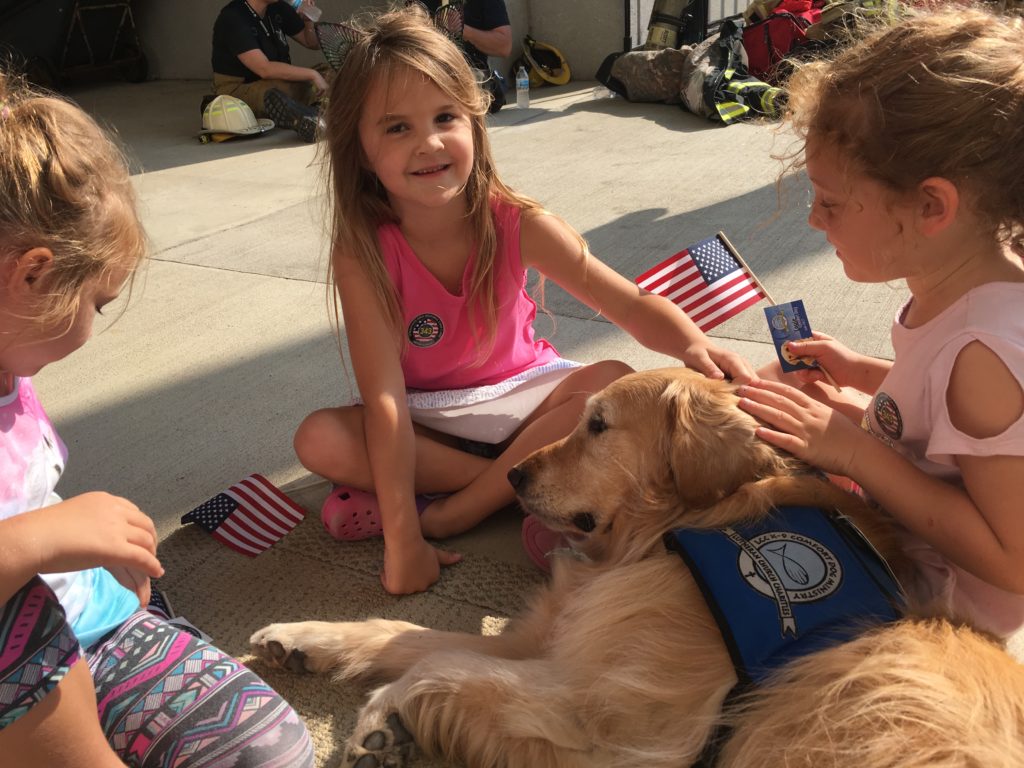 Louie Comfort Dog visiting with children