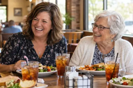 Lutheran Ladies Lunch — four women of different ages laughing together over salads and iced tea at a Joplin restaurant